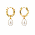14K gold plated sterling silver pearl huggie hoop earrings with freshwater pearls.